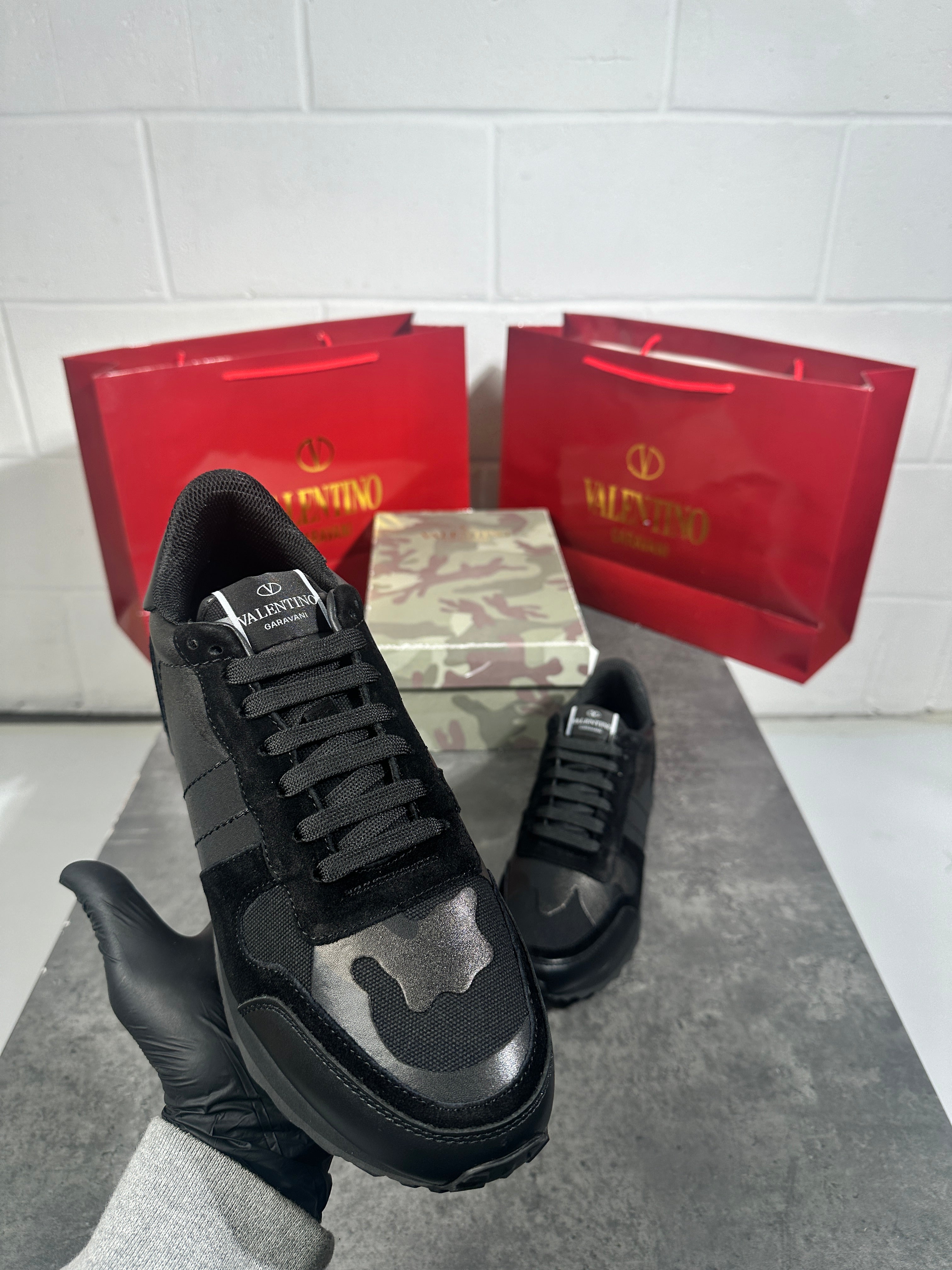 Valentino - triple black trainers