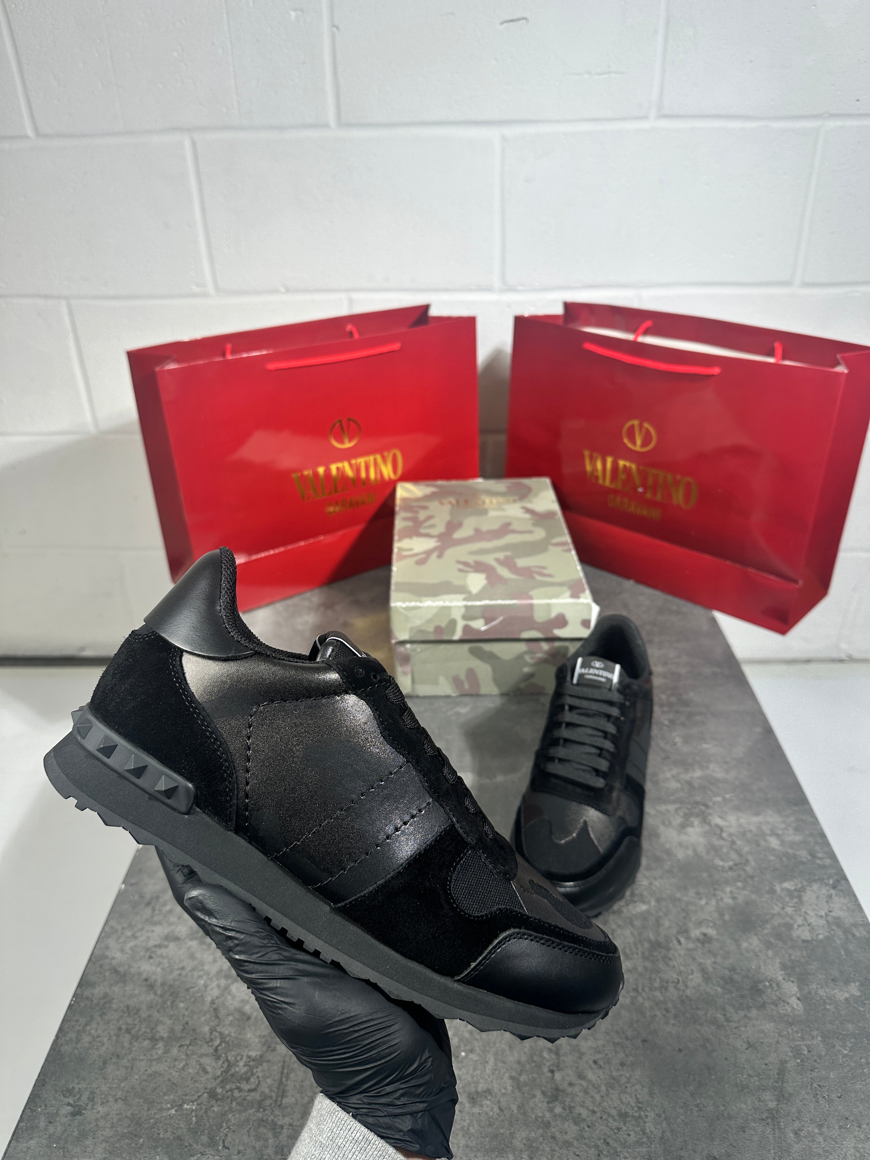 Valentino - triple black trainers